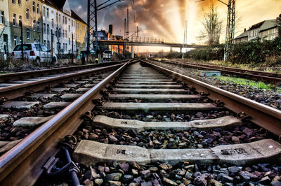 Surface level of railroad tracks against sky