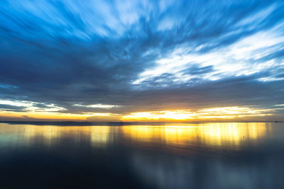 Scenic view of sea against sky at sunset