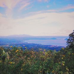 Scenic view of sea against cloudy sky