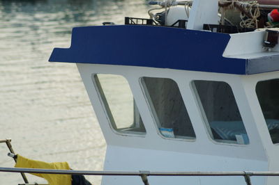 Close-up of boats moored on beach