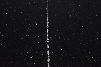 Close-up of water flowing at night