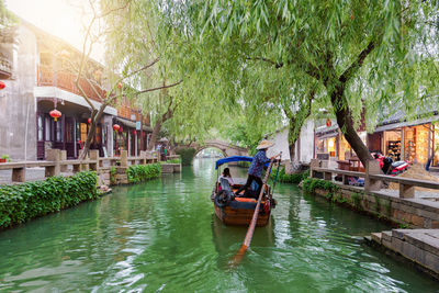 People in boat on canal