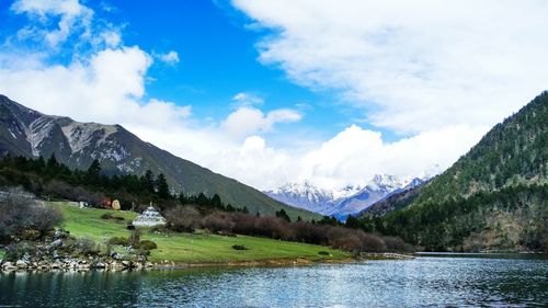 Low angle view of mountains against blue sky