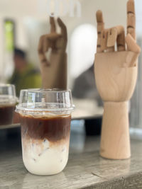 Close-up of coffee in glass on table