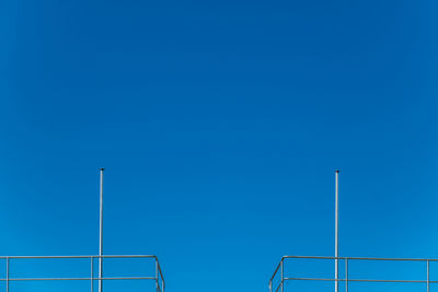 Low angle view of tree against clear blue sky