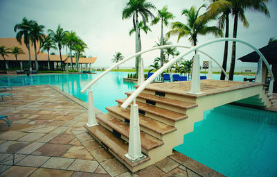 View of swimming pool against blue sky