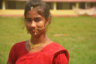 Portrait of smiling girl on field