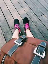 Low section of woman standing on tiled floor