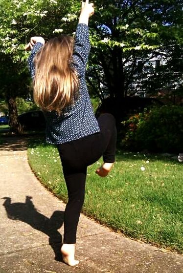 WOMAN STANDING IN PARK