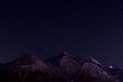 Low angle view of mountain range at night