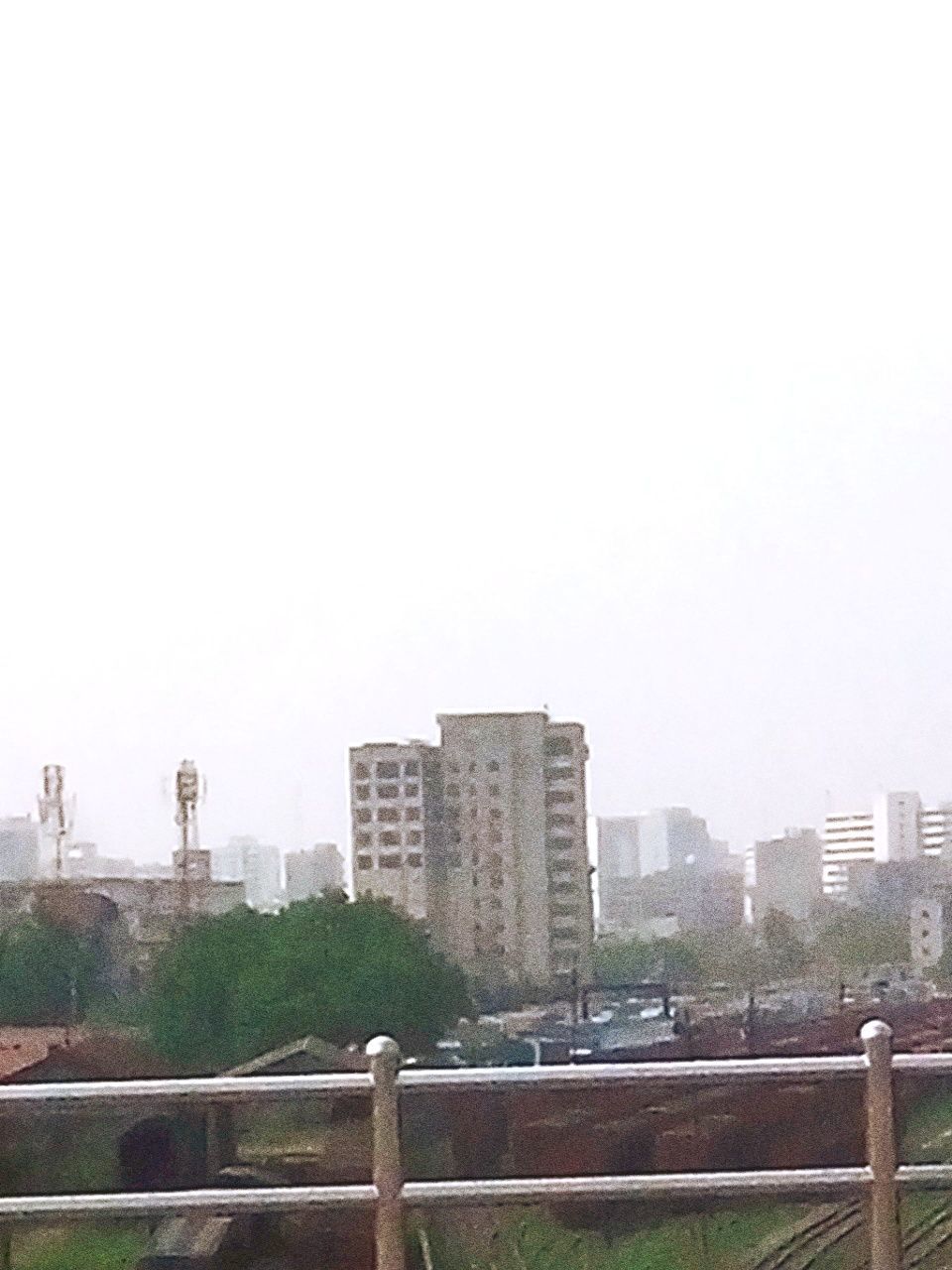 clear sky, copy space, built structure, architecture, building exterior, city, cityscape, railing, skyscraper, urban skyline, river, bridge - man made structure, day, transportation, tower, outdoors, connection, tall - high, no people, water