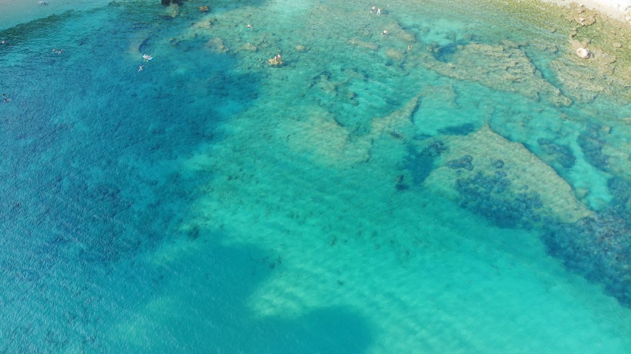 HIGH ANGLE VIEW OF UNDERWATER SWIMMING POOL