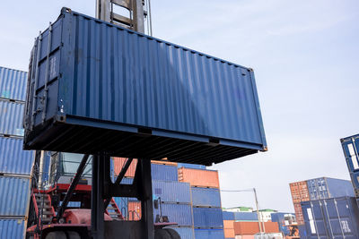 Forklift handling containers box at work warehouse area thailand