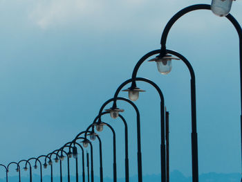 Street lamps against sky