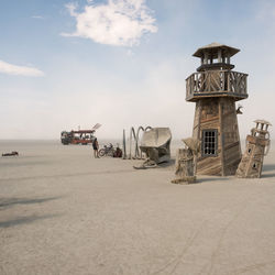 Lifeguard hut on beach against sky