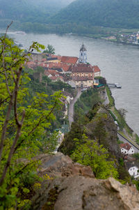 High angle view of townscape by sea