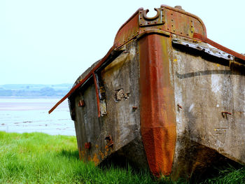 View of built structure by calm sea