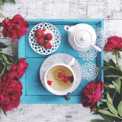 High angle view of roses in vase on table