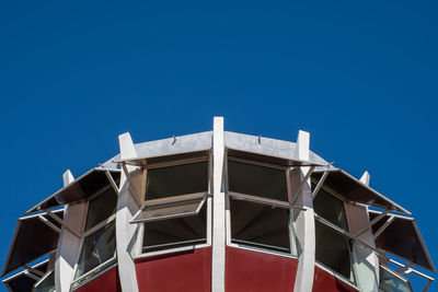 Low angle view of building against clear blue sky