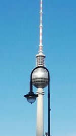 Low angle view of modern building against blue sky