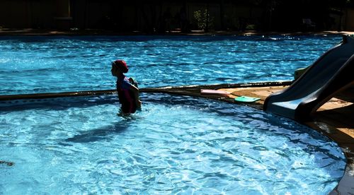 Woman swimming in pool