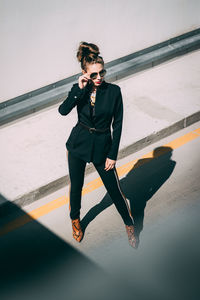 Fashionable woman standing in city