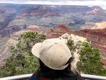 Rear view of a man with mountain range in the background