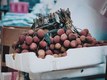 Close-up of fruits in box at market stall