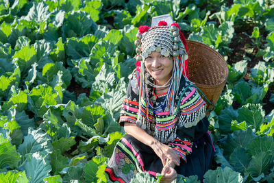 Woman standing by plants