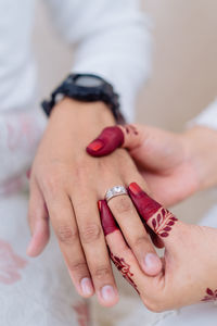 Cropped image of bride groom in engagement ceremony