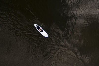 High angle view of man rowing boat in lake