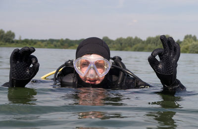 Portrait of man gesturing while scuba diving