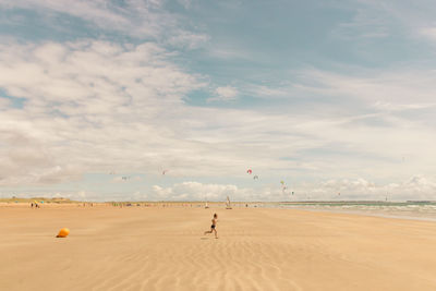 Teenager boy running on beach