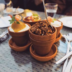 Close-up of dessert in containers on table at restaurant