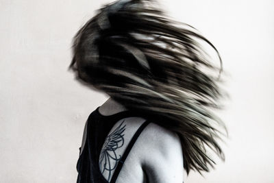 Close-up of woman over white background