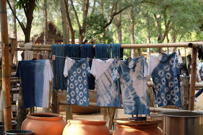 Clothes drying on string against trees