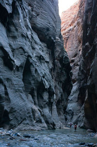 Low angle view of rocks in water