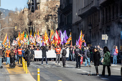 People walking on street in city on manifestation