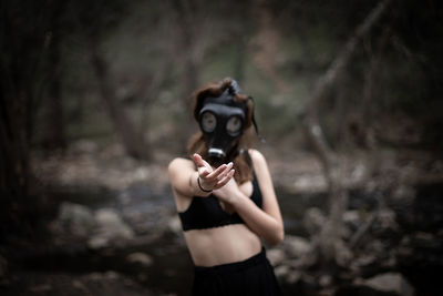 Woman wearing gas mask