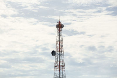 Low angle view of communications tower against sky