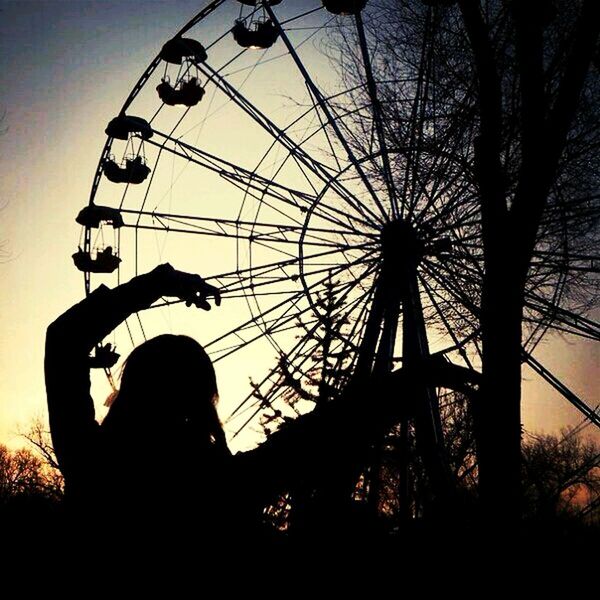 silhouette, arts culture and entertainment, sky, sunset, leisure activity, ferris wheel, amusement park, one person, men, outdoors, day, people