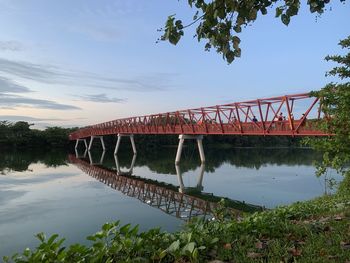 Bridge over river against sky