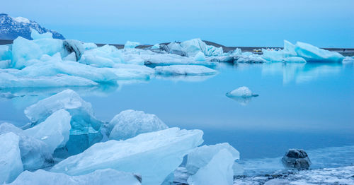 Scenic view of frozen sea against sky