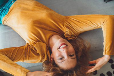 High angle view of woman sitting on floor