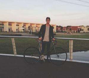 Full length of woman standing against sky