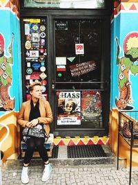 Young woman sitting in store