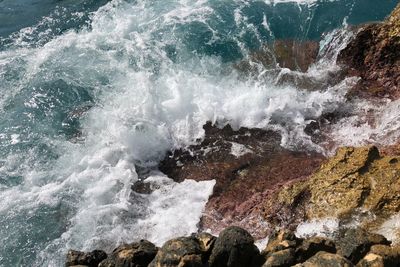 View of waves splashing on rocks