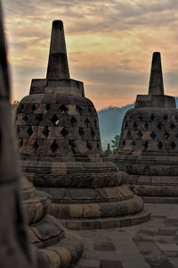 View of temple against cloudy sky