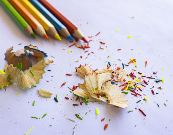 High angle view of multi colored pencils on table