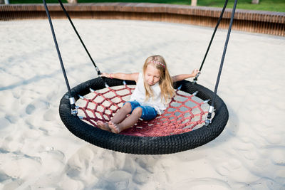 Portrait of smiling young woman in playground